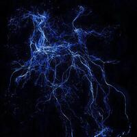 A stunning array of blue particles erupts into a bright display, scattering in multiple directions, leaving glowing trails that create a radiant spectacle in the darkness. photo