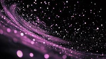 Scattered pink dots gracefully form a swirling spiral against a stark black background, creating a soft, glowing effect that captivates the senses and ignites the imagination. photo
