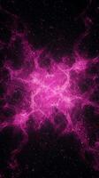 mesmerizing formation of pink particles spirals outward, creating a glowing vortex at the center. The dynamic energy suggests an otherworldly cosmic phenomenon full of vibrant life. photo