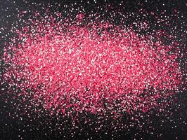 captivating arrangement of pink dots glows with varying intensities against a black background, creating a mesmerizing stardust effect reminiscent of a cosmic wonderland. photo