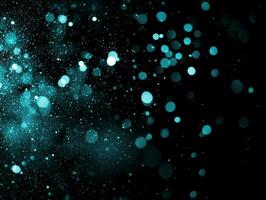 Turquoise particles scatter chaotically across a deep black background, glowing in varying intensities to create a mesmerizing stardust effect reminiscent of the cosmos. photo