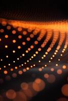 Delicate orange dots create a flowing wave pattern against a stark black backdrop, evoking a sense of motion and tranquility in this captivating abstract composition. photo