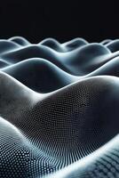Silvery dots create a dynamic wave pattern across a black canvas, with some particles appearing blurred to enhance the sense of fluid motion and depth in this abstract design. photo