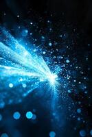 A breathtaking display of blue particles erupts, scattering and glowing with energy. The cosmic affair unfolds against a dark background, igniting imagination and awe. photo