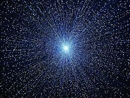 Vibrant blue dots and particles explode outward from a bright center, creating a mesmerizing display of energy and movement against a deep black background, highlighting contrast and dynamism. photo