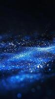 A breathtaking display of blue particles bursts into radiant waves, casting an ethereal glow through the darkness, resembling a cosmic phenomenon full of shimmering beauty. photo
