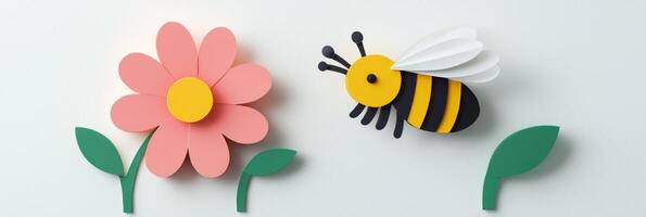 charming honeybee flutters near a pink flower, both crafted from colorful paper. Set against a plain white background, this artwork captures the essence of a sunny garden. photo