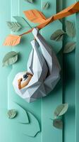 delightful sloth dangles from a branch, crafted from layers of grey and brown paper, with lush green leaves nearby, all set against a serene light blue background. photo