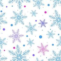 Blue, purple, and pink snowflakes in various sizes are arranged in a seamless pattern on a white background. The pattern includes scattered dots in matching colors, creating a festive and wintry vector