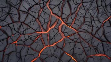 Hot lava through cracked ground. Burnt black magma and soil texture. background Surface of an active volcano. photo