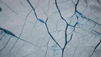 top view of cracks in lake ice with texture as background. photo