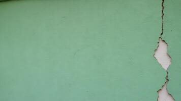 dark green cracked wall with texture as background photo