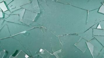 broken glass texture on green background photo