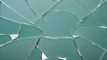 broken glass texture on green background photo