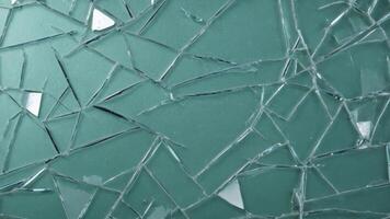 broken glass texture on green background photo