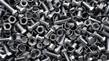 top view of nuts and bolts with texture as background photo