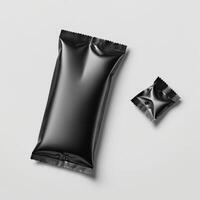 Blank black sachet package isolated on white. Small packaging sachet mockup. photo