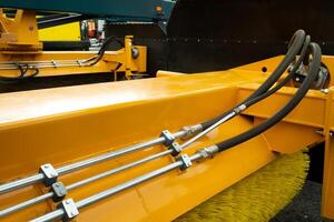 Close-up of an assembly with hydraulic pipes and couplings on a truck photo