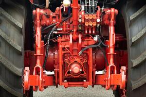 Close-up of part of the new red tractor. Vehicle assembly photo