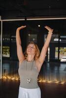The girl does yoga and is in a state of meditation. The concept of a healthy lifestyle photo