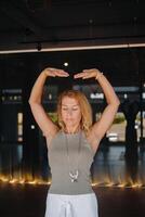 The girl does yoga and is in a state of meditation. The concept of a healthy lifestyle photo