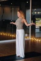 The girl does yoga and is in a state of meditation. The concept of a healthy lifestyle photo