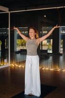 The girl does yoga and is in a state of meditation. The concept of a healthy lifestyle photo