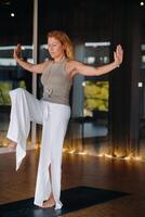 The girl does yoga and is in a state of meditation. The concept of a healthy lifestyle photo