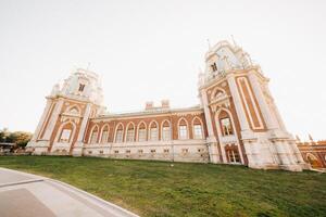 Grand Palace in Tsaritsyno in summer, Russia. Tsaritsyno Park is one of the main tourist attractions in Moscow. Beautiful scenic view of the old Tsaritsyn complex in summer photo