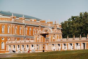 Grand Palace in Tsaritsyno in summer, Russia. Tsaritsyno Park is one of the main tourist attractions in Moscow. Beautiful scenic view of the old Tsaritsyn complex in summer photo