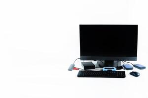 Multiple external hard drives connected to a monoblock on a white background.Computer with hard drive photo