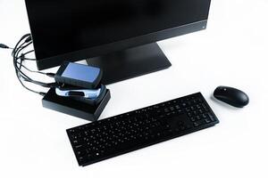 Multiple external hard drives connected to a monoblock on a white background.Computer with hard drive photo