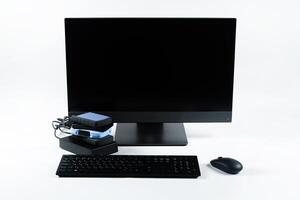 Multiple external hard drives connected to a monoblock on a white background.Computer with hard drive photo