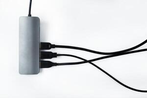 Adapter with external hard drives on a white background.Many different connections via the USB connector photo