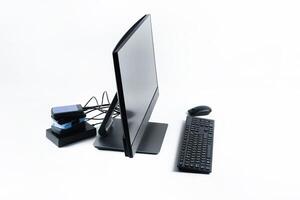 Multiple external hard drives connected to a monoblock on a white background.Computer with hard drive photo