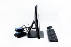Multiple external hard drives connected to a monoblock on a white background.Computer with hard drive photo