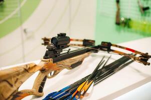 crossbow with arrows for shooting at a shooting range.Weapons for shooting at a shooting range. photo