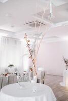 wedding table decoration with flowers on the table in winter style, photo