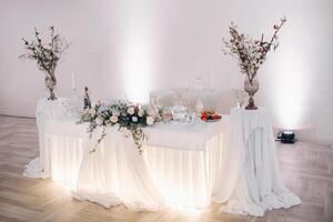 wedding table decoration with flowers on the table in winter style, photo