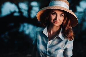 Portrait of a beautiful young lady in a straw hat photo