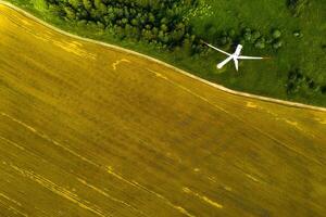 Windmills on the background of forests and fields. Windmill in nature.Belarus photo