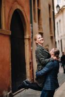 Beautiful family with walks in the old city of Lyon in France.A couple walks through old Lyon in France photo