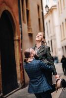Beautiful family with walks in the old city of Lyon in France.A couple walks through old Lyon in France photo