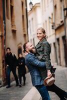 Beautiful family with walks in the old city of Lyon in France.A couple walks through old Lyon in France photo