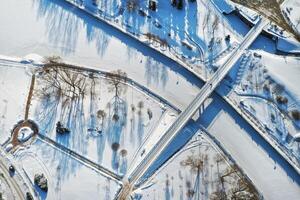 Top view of the pedestrian bridge over the frozen Svisloch river in Minsk. Belarus photo