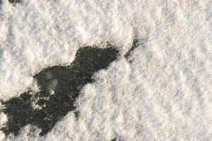snow background. Snow lying on the ice. Snow texture photo
