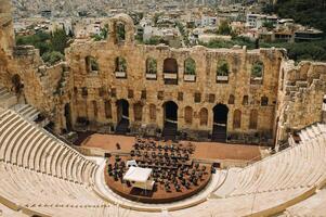 Ancient theater in a summer day in Acropolis Greece, Athnes photo