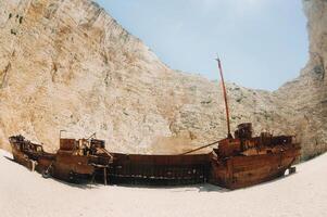 curved ship on Zakynthos island, Greece Navagio beach, or shipwreck beach,sometimes called smugglers ' Bay , on the coast of Zakynthos island, in the Ionian Islands of Greece. photo