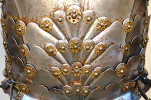 Parts of ancient knight's armor.A medieval concept.Metallic texture photo