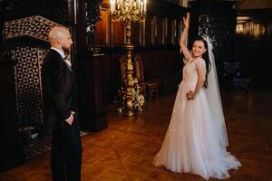 Elegant wedding couple in the interior of the old castle in the city of Nesvizh photo